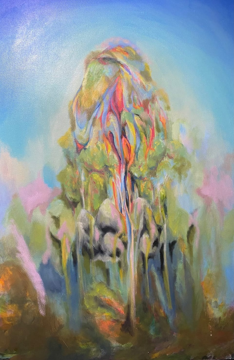 The Mountain, original oil painting on canvas by Mia Cugasi, a towering peak streaked with ribbons of rose, coral, green, and violet rising into a pale blue sky, 24 by 36 inches